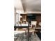 Cozy living space with a wet bar, built-in shelving, a large TV, and an area rug at 1133 14Th St # 1820, Denver, CO 80202