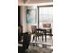 Home office space with views, striped chairs, and a dark wood table atop an elegant area rug at 1133 14Th St # 1820, Denver, CO 80202