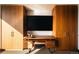 Stylish home office with built-in storage, modern desk, and a large screen for entertainment at 1133 14Th St # 1820, Denver, CO 80202