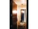 Elegant powder room featuring modern fixtures, a vessel sink, and a sleek wood door at 1133 14Th St # 1820, Denver, CO 80202