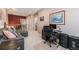 Upstairs living area with a comfortable seating area, desk, and neutral carpet at 860 Bristle Pine Cir # A, Highlands Ranch, CO 80129