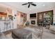 Open living area boasts a fireplace, large TV, and seamless flow into the kitchen at 860 Bristle Pine Cir # A, Highlands Ranch, CO 80129