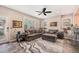 Inviting living room with plush seating, a ceiling fan, and plenty of natural light at 860 Bristle Pine Cir # A, Highlands Ranch, CO 80129