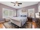 Serene main bedroom with ample natural light, stylish furnishings, and hardwood floors at 860 Bristle Pine Cir # A, Highlands Ranch, CO 80129