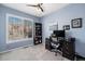 Comfortable home office featuring a large window with plantation shutters and a work space at 860 Bristle Pine Cir # A, Highlands Ranch, CO 80129