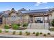 Clubhouse exterior showcasing stone accents, solar panels, and manicured landscaping at 19629 W 93Rd Dr # C, Arvada, CO 80007