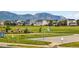 Community park with basketball court, playground, and mountain views at 19629 W 93Rd Dr # C, Arvada, CO 80007