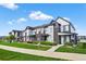 Beautiful townhomes with modern exteriors, lush landscaping, and inviting curb appeal at 19629 W 93Rd Dr # C, Arvada, CO 80007