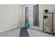 Bright flex room is staged with exercise ball, yoga mat, and shelving unit at 19629 W 93Rd Dr # C, Arvada, CO 80007