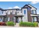Modern townhome exterior with mixed materials and landscaped front yard at 19629 W 93Rd Dr # C, Arvada, CO 80007