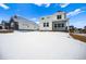 Backyard with snowy lawn and two-story house, perfect for outdoor activities and relaxation at 39720 Congress Ln, Elizabeth, CO 80107