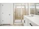 Bathroom featuring a vanity with solid-surface counter and a shower at 39720 Congress Ln, Elizabeth, CO 80107