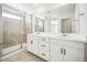 Bathroom showcasing double vanity sinks and walk-in glass shower at 39720 Congress Ln, Elizabeth, CO 80107