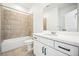 Well-lit bathroom with shower and tub, vanity, and neutral finishes at 39720 Congress Ln, Elizabeth, CO 80107