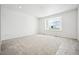 Well-lit bedroom boasts a large window and recessed ceiling lights at 39720 Congress Ln, Elizabeth, CO 80107