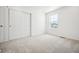 Bedroom featuring carpet, closet, and large window allowing natural light at 39720 Congress Ln, Elizabeth, CO 80107