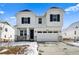 Beautiful two-story home featuring a two car garage, porch and well-manicured lawn at 39720 Congress Ln, Elizabeth, CO 80107
