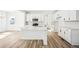 Bright kitchen with an island, stainless steel appliances, and stylish backsplash at 39720 Congress Ln, Elizabeth, CO 80107