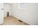 Functional laundry room with tile flooring, a utility sink, and a window for natural light at 39720 Congress Ln, Elizabeth, CO 80107