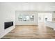 Spacious living room with luxury vinyl flooring and a modern fireplace feature at 39720 Congress Ln, Elizabeth, CO 80107