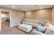 Bright finished basement featuring neutral carpet, a sofa, ottoman, and chair at 10679 Union Way, Broomfield, CO 80021