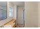 Bright bathroom featuring modern fixtures, a wooden vanity, and natural light at 10679 Union Way, Broomfield, CO 80021