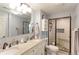 Stylish bathroom featuring double sinks, granite counters and a glass shower at 10679 Union Way, Broomfield, CO 80021