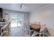 Bright dining area with access to a deck, features wood table and six chairs at 10679 Union Way, Broomfield, CO 80021