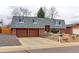 Charming brick home featuring a two-car garage and a well-maintained landscaped front yard at 10679 Union Way, Broomfield, CO 80021