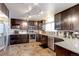 Updated kitchen featuring stainless steel appliances, granite countertops, and ample cabinet space at 10679 Union Way, Broomfield, CO 80021