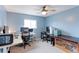 Bright office space with two computer setups and a large window offering natural light at 10679 Union Way, Broomfield, CO 80021
