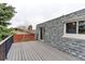 Upper level deck with gray composite decking, black railings, and access to the upper-level rooms at 10679 Union Way, Broomfield, CO 80021