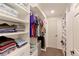 Spacious walk-in closet with custom shelving and ample storage for clothing and personal items at 10679 Union Way, Broomfield, CO 80021