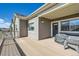 Well-lit deck space for relaxing outdoors; includes a grill and a stacked set of chairs at 12708 Tamarac St, Thornton, CO 80602