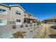 Exterior view of home with a deck, highlighting landscaping with rocks, plants, and a grassy lawn at 12708 Tamarac St, Thornton, CO 80602