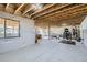 Unfinished basement with exposed ceiling and a window for natural light, ready for customization and fitness at 12708 Tamarac St, Thornton, CO 80602
