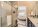 Contemporary bathroom displays a glass-enclosed shower, sleek fixtures, and convenient access to the bedroom at 12708 Tamarac St, Thornton, CO 80602