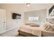 Comfortable bedroom features a bed and television for optimal relaxation at 12708 Tamarac St, Thornton, CO 80602