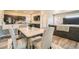 Bright open concept view from dining area into kitchen and living room at 12708 Tamarac St, Thornton, CO 80602
