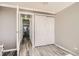 Bedroom features wood floors, sliding-door closet, white trim, and neutral paint at 789 N Clarkson St # 705, Denver, CO 80218