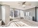 Well-lit bedroom with windows offering city views, dresser, and wood floors at 789 N Clarkson St # 705, Denver, CO 80218