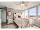 Bright bedroom featuring wood floors, and ample natural light with large windows offering city views at 789 N Clarkson St # 705, Denver, CO 80218