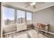 Bright bedroom features hardwood floors, ceiling fan, and large windows offering stunning city views at 789 N Clarkson St # 705, Denver, CO 80218