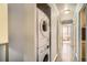 Hallway with modern washer and dryer hookups and beautiful wood floors at 789 N Clarkson St # 705, Denver, CO 80218