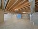 Spacious unfinished basement with exposed ceiling and concrete flooring at 12742 E 104Th Dr, Commerce City, CO 80022