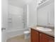 Clean bathroom featuring a shower and tub combination, vanity with storage, and tile flooring at 12742 E 104Th Dr, Commerce City, CO 80022