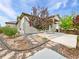Charming home exterior showcasing landscaped front yard with stone pathway and mature trees at 12742 E 104Th Dr, Commerce City, CO 80022