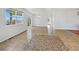 Bright living area with tile flooring, large windows, and doors to the outdoors, perfect for entertaining at 12742 E 104Th Dr, Commerce City, CO 80022