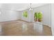 Spacious living area with tile flooring, sliding glass door, and ample natural light at 12742 E 104Th Dr, Commerce City, CO 80022