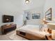 Cozy main bedroom with natural light, a modern dresser, and neutral decor at 12742 E 104Th Dr, Commerce City, CO 80022